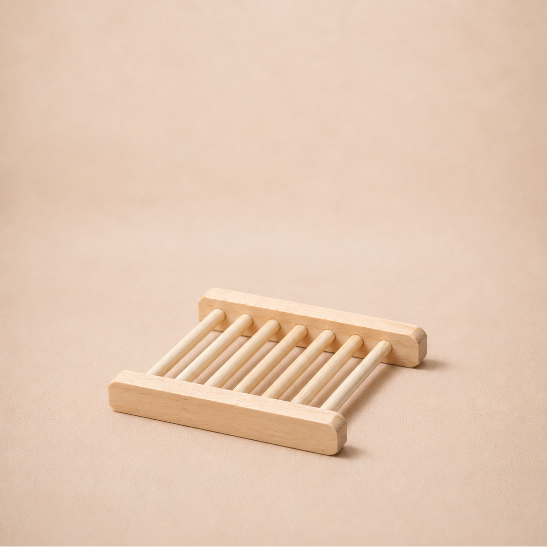 Wooden soap dish on a beige background