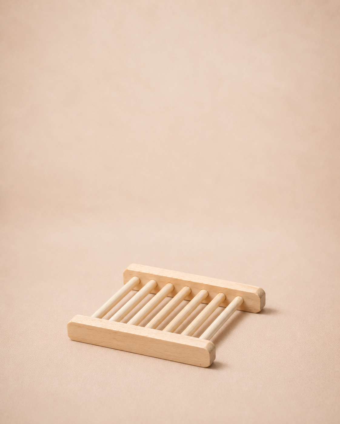 Wooden soap dish on a beige background